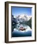 Boats moored in Lake Braies (Pragser Wildsee) with mountains reflected in water-Roberto Moiola-Framed Photographic Print