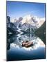 Boats moored in Lake Braies (Pragser Wildsee) with mountains reflected in water-Roberto Moiola-Mounted Photographic Print