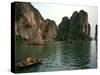 Boats Move Among the Craggy Islands of Halong Bay-null-Stretched Canvas