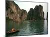 Boats Move Among the Craggy Islands of Halong Bay-null-Mounted Photographic Print