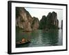 Boats Move Among the Craggy Islands of Halong Bay-null-Framed Photographic Print
