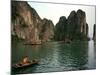 Boats Move Among the Craggy Islands of Halong Bay-null-Mounted Photographic Print