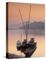 Boats on Mekong River at Sunset, Luang Prabang, Laos-Ian Trower-Stretched Canvas