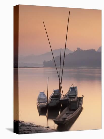 Boats on Mekong River at Sunset, Luang Prabang, Laos-Ian Trower-Stretched Canvas