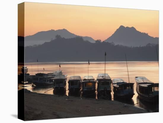 Boats on Mekong River at Sunset, Luang Prabang, Laos-Ian Trower-Stretched Canvas