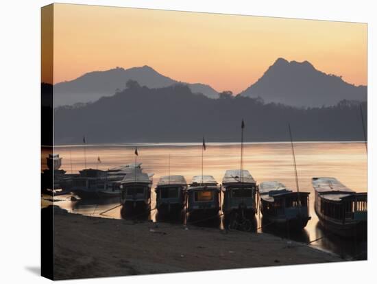 Boats on Mekong River at Sunset, Luang Prabang, Laos-Ian Trower-Stretched Canvas