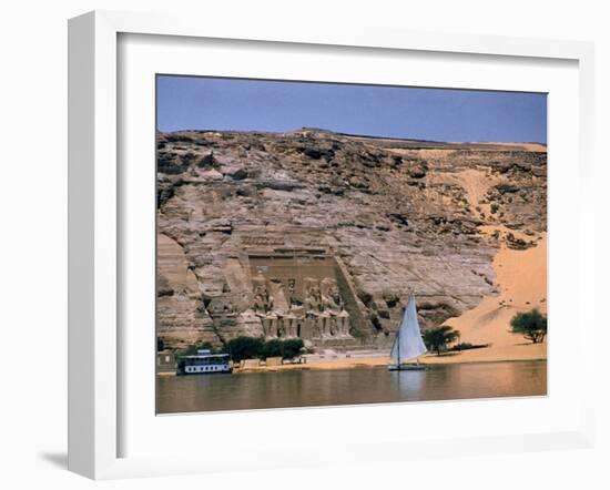 Boats on Nile River Passing Massive Statues of Pharoh Ramses II at Door to Queen Nefertari's Temple-James Burke-Framed Photographic Print