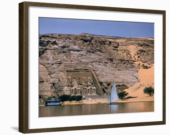 Boats on Nile River Passing Massive Statues of Pharoh Ramses II at Door to Queen Nefertari's Temple-James Burke-Framed Photographic Print