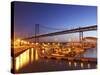 Boats on the River Tagus Move at Night in the Doca De Santa Amaro Marina under the 25 April Bridge,-Stuart Forster-Stretched Canvas