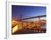 Boats on the River Tagus Move at Night in the Doca De Santa Amaro Marina under the 25 April Bridge,-Stuart Forster-Framed Photographic Print