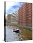 Boats Pass by Waterfront Warehouses and Lofts, Speicherstadt Warehouse District, Hamburg, Germany-Miva Stock-Stretched Canvas