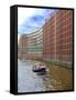 Boats Pass by Waterfront Warehouses and Lofts, Speicherstadt Warehouse District, Hamburg, Germany-Miva Stock-Framed Stretched Canvas