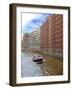 Boats Pass by Waterfront Warehouses and Lofts, Speicherstadt Warehouse District, Hamburg, Germany-Miva Stock-Framed Photographic Print