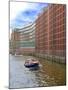 Boats Pass by Waterfront Warehouses and Lofts, Speicherstadt Warehouse District, Hamburg, Germany-Miva Stock-Mounted Photographic Print