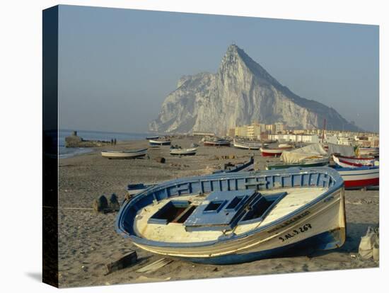 Boats Pulled onto Beach Below the Rock of Gibraltar, Gibraltar-Charles Bowman-Stretched Canvas