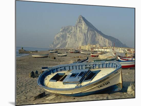 Boats Pulled onto Beach Below the Rock of Gibraltar, Gibraltar-Charles Bowman-Mounted Photographic Print