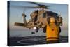 Boatswain's Mate Guides an Mh-60R Sea Hawk onto the Flight Deck-null-Stretched Canvas
