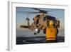 Boatswain's Mate Guides an Mh-60R Sea Hawk onto the Flight Deck-null-Framed Photographic Print