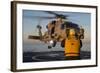 Boatswain's Mate Guides an Mh-60R Sea Hawk onto the Flight Deck-null-Framed Photographic Print