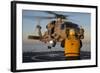 Boatswain's Mate Guides an Mh-60R Sea Hawk onto the Flight Deck-null-Framed Photographic Print