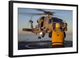 Boatswain's Mate Guides an Mh-60R Sea Hawk onto the Flight Deck-null-Framed Photographic Print