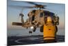 Boatswain's Mate Guides an Mh-60R Sea Hawk onto the Flight Deck-null-Mounted Photographic Print