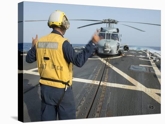 Boatswainâs Mate Signals to the Pilot of an Mh-60R Sea Hawk-null-Stretched Canvas