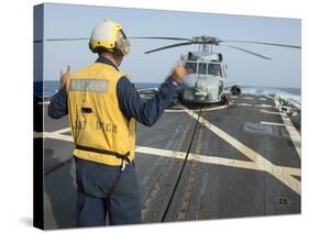 Boatswainâs Mate Signals to the Pilot of an Mh-60R Sea Hawk-null-Stretched Canvas