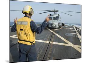 Boatswainâs Mate Signals to the Pilot of an Mh-60R Sea Hawk-null-Mounted Photographic Print