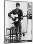 Bob Dylan Playing Guitar and Harmonica into Microphone. 1965-null-Mounted Art Print