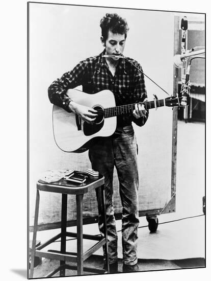 Bob Dylan Playing Guitar and Harmonica into Microphone. 1965-null-Mounted Art Print
