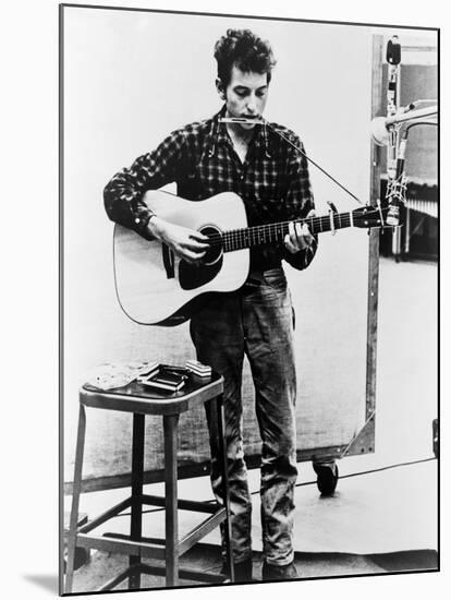 Bob Dylan Playing Guitar and Harmonica into Microphone. 1965-null-Mounted Art Print