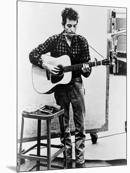 Bob Dylan Playing Guitar and Harmonica into Microphone. 1965-null-Mounted Art Print