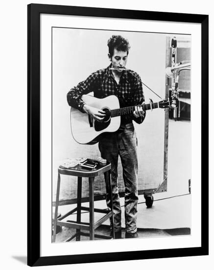 Bob Dylan Playing Guitar and Harmonica into Microphone. 1965-null-Framed Art Print