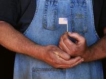 Man Holding Small American Flag-Bob Rowan-Framed Stretched Canvas