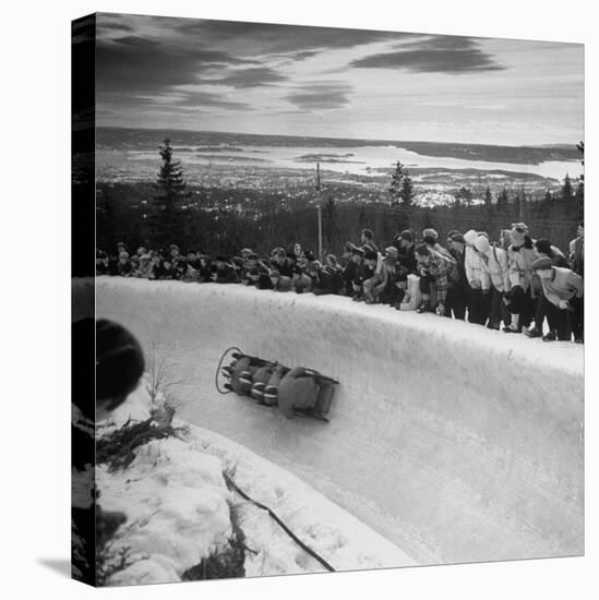 Bobsled Racing by on a Big Vendleboe Curve During the Winter Olympics-Nat Farbman-Stretched Canvas