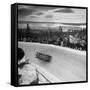 Bobsled Racing by on a Big Vendleboe Curve During the Winter Olympics-Nat Farbman-Framed Stretched Canvas