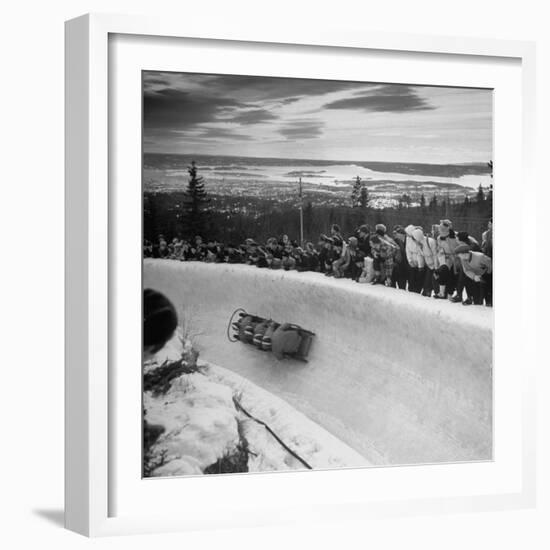 Bobsled Racing by on a Big Vendleboe Curve During the Winter Olympics-Nat Farbman-Framed Premium Photographic Print