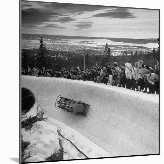 Bobsled Racing by on a Big Vendleboe Curve During the Winter Olympics-Nat Farbman-Mounted Premium Photographic Print