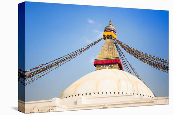 Bodhnath Stupa with Buddha Eyes and Prayer Flags, Clear Blue Sky, Kathmandu, Nepal. Stock Photo:-De Visu-Stretched Canvas