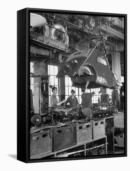 Body Being Lowered on to "Topolino" Chassis by Workers on Assembly Line at Fiat Production Plant-Alfred Eisenstaedt-Framed Stretched Canvas