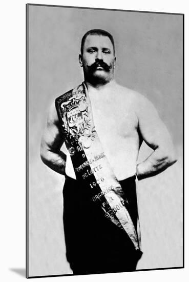 Bodybuilder Wearing Bandolier of Victory-null-Mounted Art Print