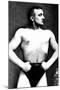 Bodybuilder with Thumbs Tucked in Belt-null-Mounted Art Print