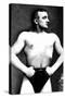 Bodybuilder with Thumbs Tucked in Belt-null-Stretched Canvas