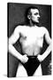 Bodybuilder with Thumbs Tucked in Belt-null-Stretched Canvas