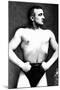 Bodybuilder with Thumbs Tucked in Belt-null-Mounted Art Print