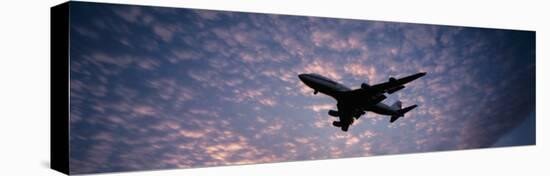 Boeing 747 Airplane in Flight Against Evening Clouds-null-Stretched Canvas