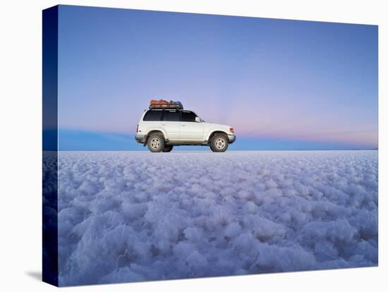 Bolivia, Potosi Department, Daniel Campos Province, White Toyota Landcruiser on the Salar de Uyuni,-Karol Kozlowski-Stretched Canvas