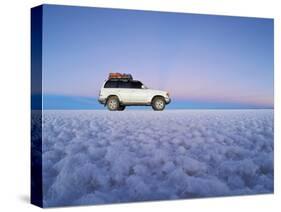 Bolivia, Potosi Department, Daniel Campos Province, White Toyota Landcruiser on the Salar de Uyuni,-Karol Kozlowski-Stretched Canvas