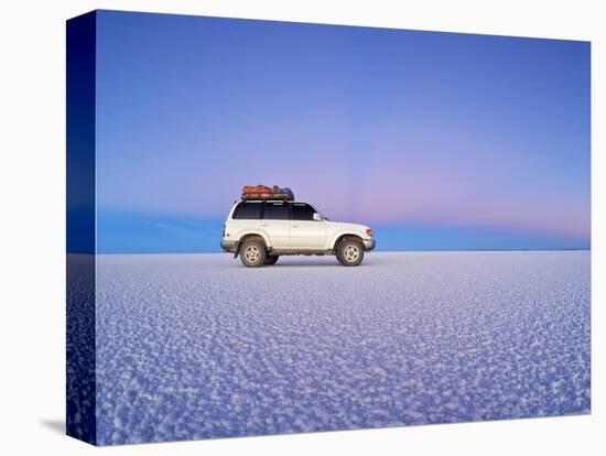 Bolivia, Potosi Department, Daniel Campos Province, White Toyota Landcruiser on the Salar de Uyuni,-Karol Kozlowski-Stretched Canvas